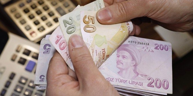 Turkish lira bills at a currency exchange office in Istanbul