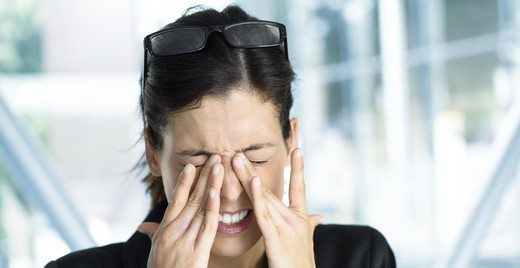 Exhausted and tired eyes business executive woman. Businesswoman stress and problems in job.